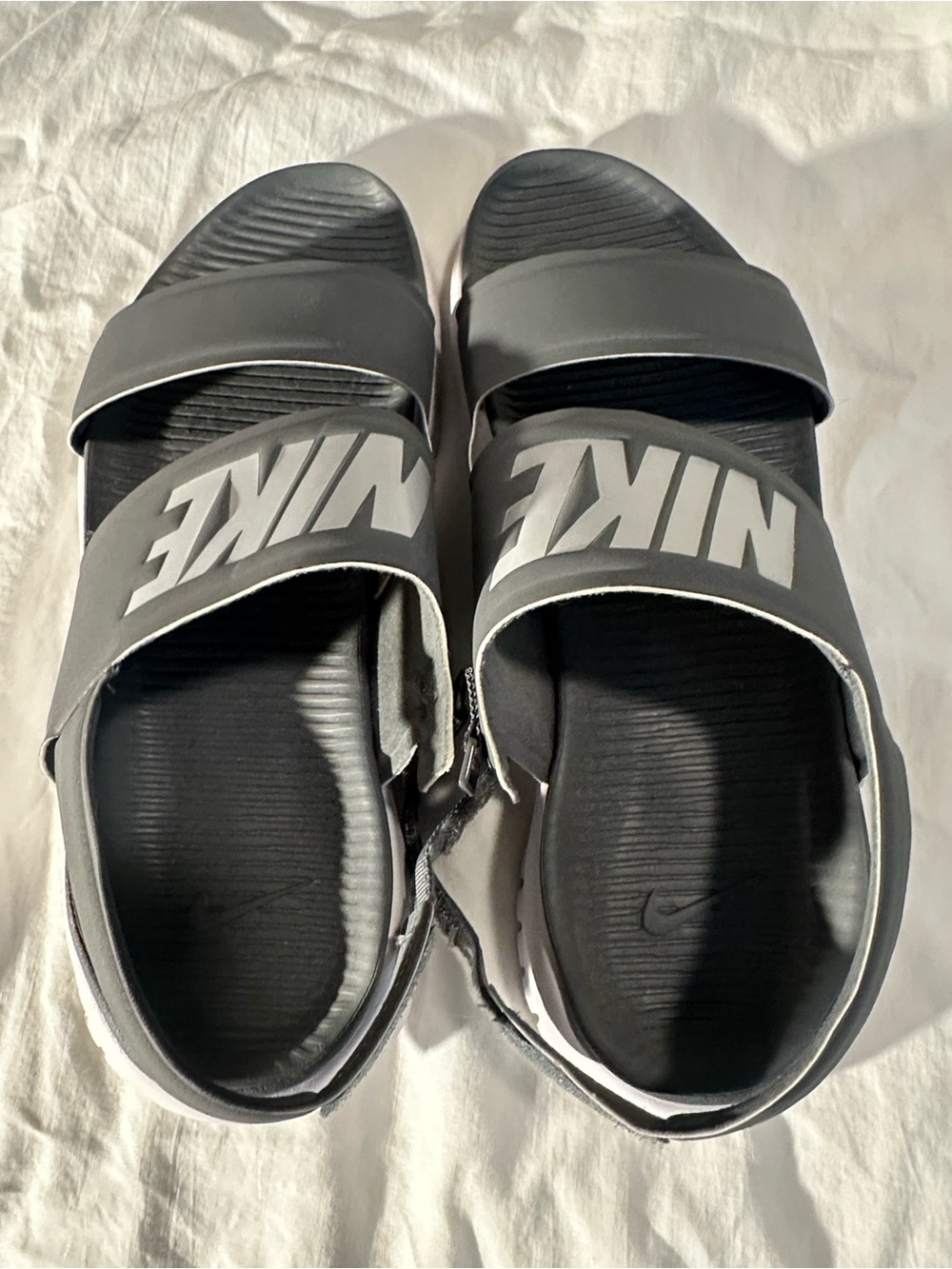 Nike Gray and White Slide Sandals with Subtle Branding